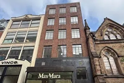 Exterior of the Back Bay office building on Newbury Street with MaxMara storefront at street level