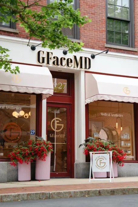 Street-level storefront of GFaceMD Medical Aesthetics with signage and awnings
