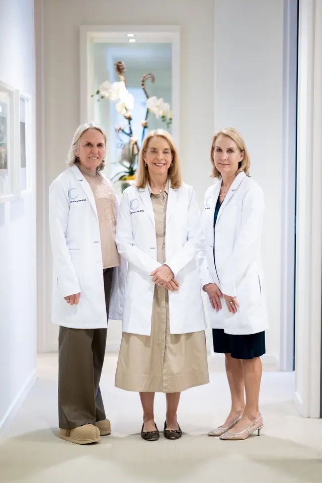 Clinical team in lab coats at the practice