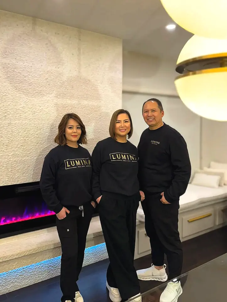 Lumina Med Spa team members in Lumina sweatshirts