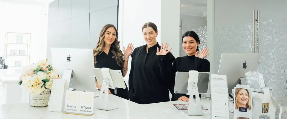 Lux Skin & Lasers team welcoming patients at the front desk