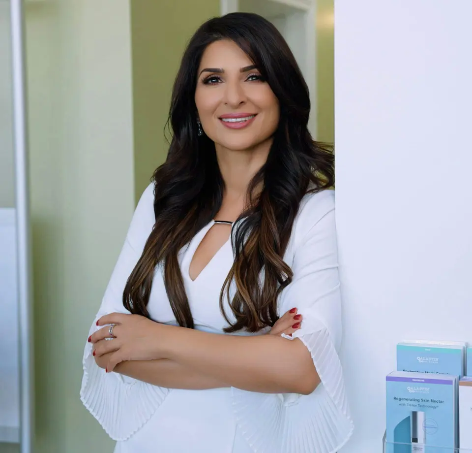 Dr. Sandhu, founder of Neem Medical Spa, in the office