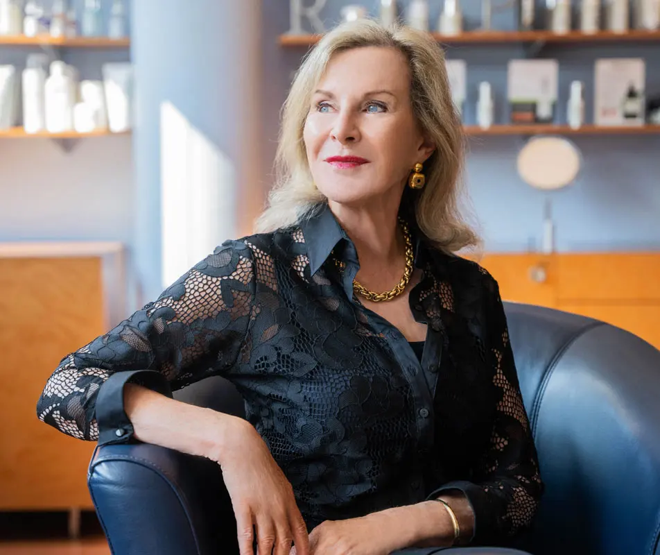 Dr. Cheryl Clarkson, founder of SkinHealth Centers, seated in the clinic