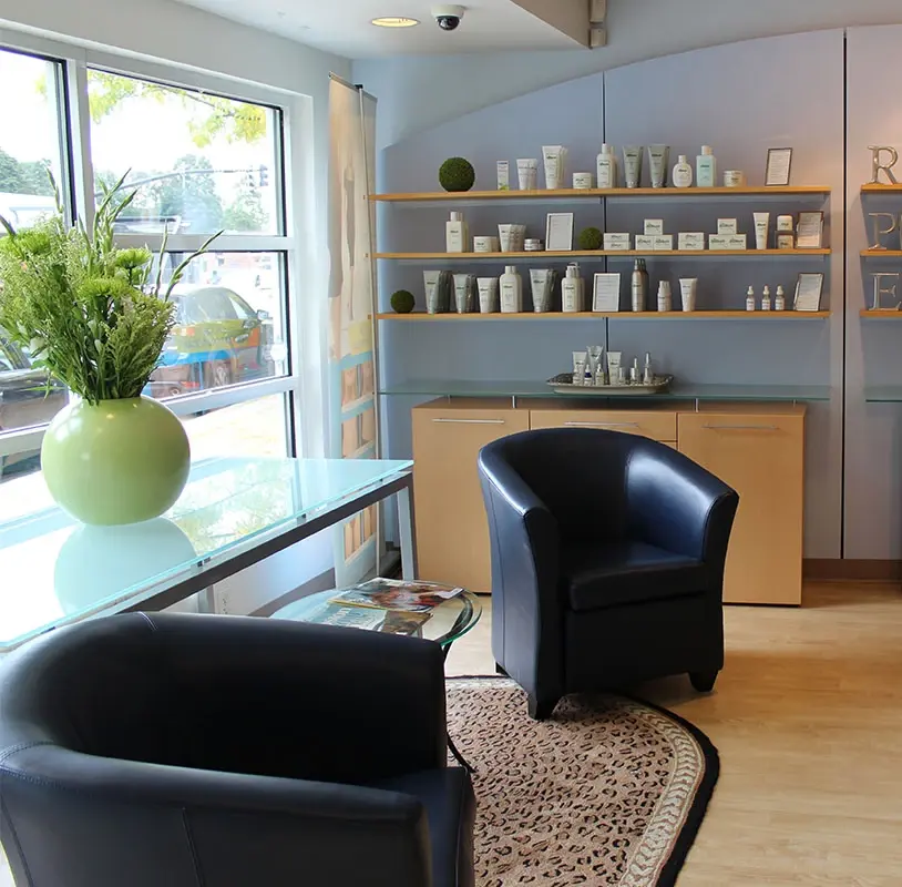 Interior of SkinHealth Centers Wellesley Hills with product display shelving and seating