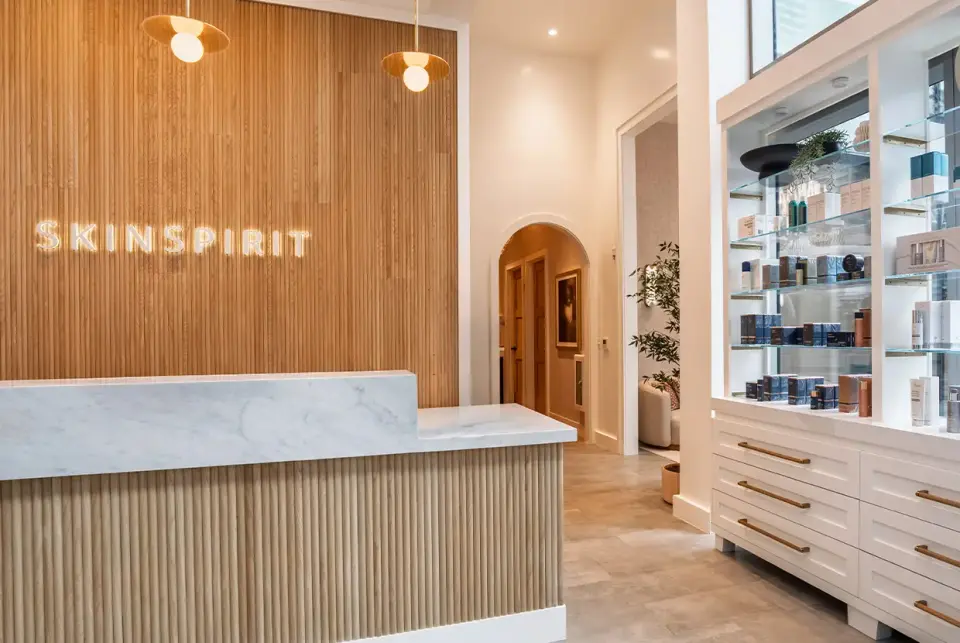 Reception desk and retail wall at SkinSpirit Miami