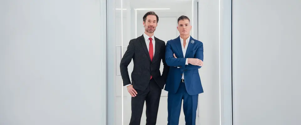 Dr. Michael Somenek and Dr. Troy Pittman in the practice hallway