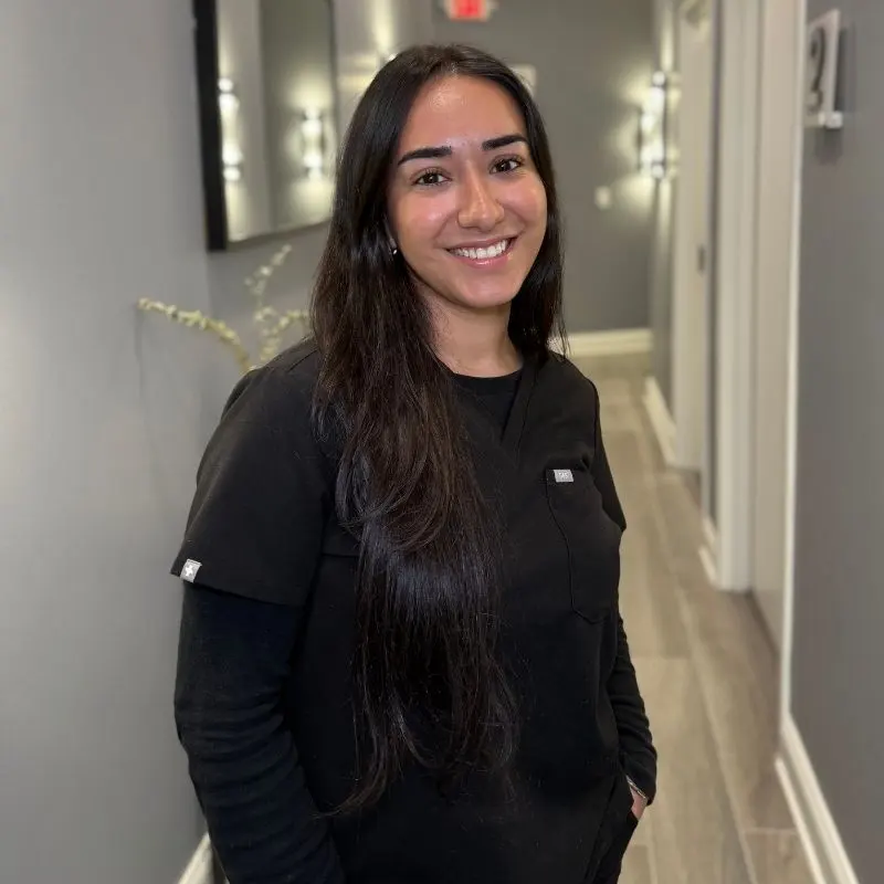 Ashley Herrera, Aesthetician, in the VIO Med Spa South End hallway